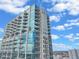 Modern high-rise building with glass facade and balconies at 777 N Ashley Dr # 2612, Tampa, FL 33602