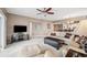 Bright living room with light beige carpeting, comfy sofas, and a ceiling fan at 960 Starkey Rd # 2501, Largo, FL 33771