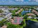 Aerial view of two tennis courts near a lake at 10263 Gandy Blvd N Blvd # 2005, St Petersburg, FL 33702
