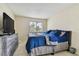 Spacious bedroom with dresser and large window bringing in natural light at 10263 Gandy Blvd N Blvd # 2005, St Petersburg, FL 33702