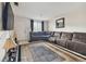 Living room with sectional sofa, large TV, and entryway at 10263 Gandy Blvd N Blvd # 2005, St Petersburg, FL 33702