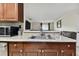 Kitchen with sink and view into living room at 10263 Gandy Blvd N Blvd # 2005, St Petersburg, FL 33702