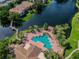 Community pool with patio and lush landscaping at 10263 Gandy Blvd N Blvd # 2005, St Petersburg, FL 33702