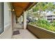 Covered exterior hallway with stairs and lush landscaping at 10263 Gandy Blvd N Blvd # 2005, St Petersburg, FL 33702