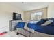 Bright bedroom with a comfortable bed and dresser at 10263 Gandy Blvd N Blvd # 2005, St Petersburg, FL 33702