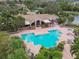 Community pool with adjacent clubhouse at 10263 Gandy Blvd N Blvd # 2005, St Petersburg, FL 33702