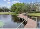 Wooden boardwalk path over calm water with lily pads at 10263 Gandy Blvd N Blvd # 2005, St Petersburg, FL 33702