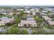Aerial view of community with lake, tennis courts, and buildings at 10263 Gandy Blvd N Blvd # 2005, St Petersburg, FL 33702