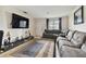 Living room features a sectional sofa and a large TV at 10263 Gandy Blvd N Blvd # 2005, St Petersburg, FL 33702