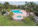 Community pool and spa with lounge chairs at 10263 Gandy Blvd N Blvd # 2005, St Petersburg, FL 33702