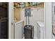 Convenient laundry room with washer, dryer, and shelving at 10263 Gandy Blvd N Blvd # 2005, St Petersburg, FL 33702