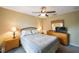 Bedroom with a queen bed, dresser, and nightstands at 1636/1640 Nebraska Ave, Palm Harbor, FL 34683