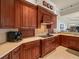 Kitchen with stainless steel appliances and custom cabinetry at 19815 Sea Rider Way, Lutz, FL 33559