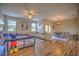 Open concept living and dining area with hardwood floors at 20028 Satin Leaf Ave, Tampa, FL 33647