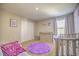 Bedroom featuring a crib, dresser, and plenty of closet space at 20028 Satin Leaf Ave, Tampa, FL 33647