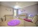 Charming Bedroom with purple rug, crib, and ample closet space at 20028 Satin Leaf Ave, Tampa, FL 33647