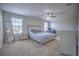 Main bedroom with carpeted floors and large windows at 20028 Satin Leaf Ave, Tampa, FL 33647