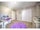 Spacious Bedroom with a crib, changing table, and ample closet space at 20028 Satin Leaf Ave, Tampa, FL 33647