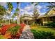 Community clubhouse with landscaped walkway and palm trees at 20028 Satin Leaf Ave, Tampa, FL 33647