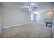 Large bonus room with carpeted floors and ceiling fan at 20028 Satin Leaf Ave, Tampa, FL 33647