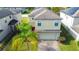 Two-story house, two-car garage, and nicely landscaped yard at 20028 Satin Leaf Ave, Tampa, FL 33647