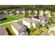 Two-story house with solar panels and lake view at 20028 Satin Leaf Ave, Tampa, FL 33647