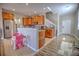 Open kitchen with granite countertops, stainless steel appliances, and a breakfast bar at 20028 Satin Leaf Ave, Tampa, FL 33647