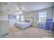 Spacious main bedroom with carpeted floor and two windows at 20028 Satin Leaf Ave, Tampa, FL 33647