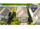 Two-story house with a two-car garage and solar panels nearby at 20028 Satin Leaf Ave, Tampa, FL 33647