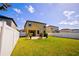 Large backyard with grassy area, patio, and fire pit at 20028 Satin Leaf Ave, Tampa, FL 33647