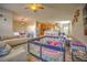Gathering-friendly living room with hardwood floors and kitchen views at 20028 Satin Leaf Ave, Tampa, FL 33647