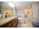 Bathroom with granite countertops, soaking tub, and shower at 20028 Satin Leaf Ave, Tampa, FL 33647