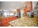 Kitchen features granite countertops, stainless steel appliances, and wood cabinets at 20028 Satin Leaf Ave, Tampa, FL 33647