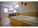 Relaxing bathroom featuring a large soaking tub at 20028 Satin Leaf Ave, Tampa, FL 33647