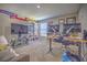 Home office with built-in shelving, large desk, and flat-screen TV at 20028 Satin Leaf Ave, Tampa, FL 33647