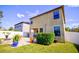 Home's backyard features a patio, fire pit, and lush landscaping at 20028 Satin Leaf Ave, Tampa, FL 33647