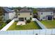 Aerial view of a fenced backyard with a patio and fire pit at 20028 Satin Leaf Ave, Tampa, FL 33647