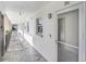 Clean and bright hallway with tile floors and apartment doors at 3789 46Th Ave # 205, St Petersburg, FL 33711