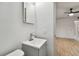 Modern bathroom with gray tile and updated vanity at 4152 55Th N Way # 1028, Kenneth City, FL 33709