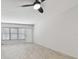 Bright living room with light wood floors and ceiling fan at 4152 55Th N Way # 1028, Kenneth City, FL 33709