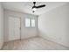 Spacious bedroom with wood-look floors and a ceiling fan at 4152 55Th N Way # 1028, Kenneth City, FL 33709