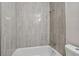 Clean bathroom with a shower/tub and gray tile at 4152 55Th N Way # 1028, Kenneth City, FL 33709
