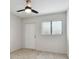 Bright bedroom featuring wood-look floors and a ceiling fan at 4152 55Th N Way # 1028, Kenneth City, FL 33709
