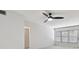 Bright living room with light wood floors and ceiling fan at 4152 55Th N Way # 1028, Kenneth City, FL 33709