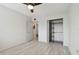 Bedroom features a ceiling fan, closet, and access to other rooms at 4152 55Th N Way # 1028, Kenneth City, FL 33709