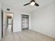 Bright bedroom with ceiling fan and walk-in closet at 4152 55Th N Way # 1028, Kenneth City, FL 33709