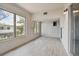 Bright sunroom with light grey vinyl flooring and multiple windows at 4152 55Th N Way # 1028, Kenneth City, FL 33709