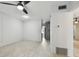 Bright living room with light wood floors and ceiling fan at 4152 55Th N Way # 1028, Kenneth City, FL 33709