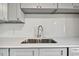 Modern kitchen with gray cabinets and stainless steel sink at 4152 55Th N Way # 1028, Kenneth City, FL 33709