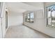 Spacious sunroom with light grey vinyl flooring and large windows at 4152 55Th N Way # 1028, Kenneth City, FL 33709